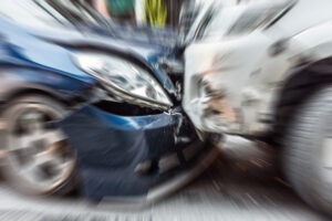 blue-car-hitting-a-garbage-truck