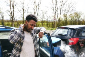 male-driver-rubbing-neck-after-accident