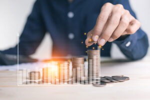 businessman-stacking-coins