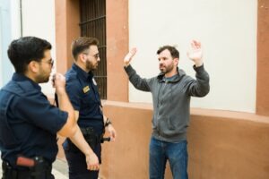 man-with-two-cops-after-assault-charge-Michigan