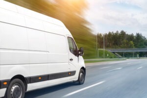 white delivery truck speeds on Grand Rapids, MI, road