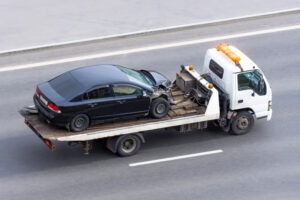 car on tow truck after crash