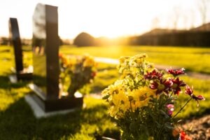 flowers on the ground at a cemetery